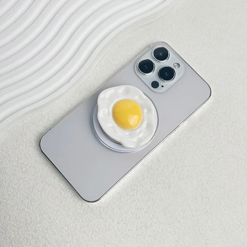 Creative Egg Phone Holder – Foldable Socket Grip & Expanding Stand for iPhone, Samsung, Mac, Magsafe