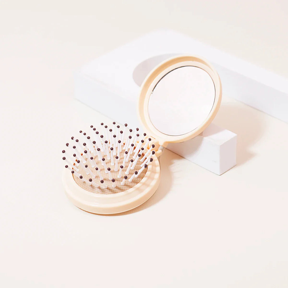 Mini Folding Head Massager & Mirror β Anti-Static Styling Comb for Wigs, Portable Travel Hair Brush