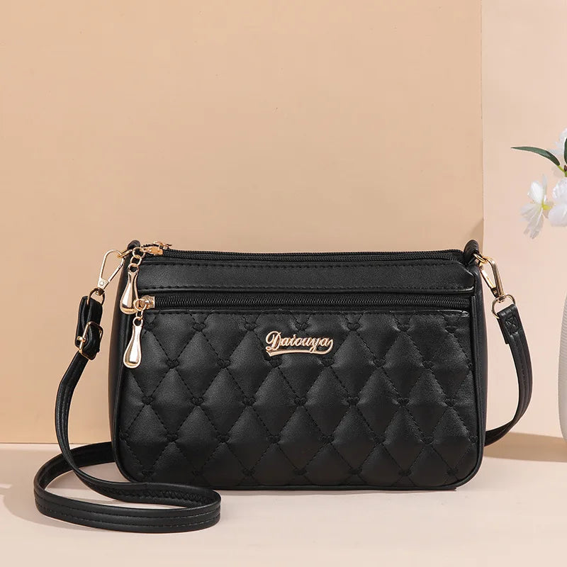 Women’s Embroidered Leather Messenger Bag - Stylish Handbag with Hair Ball Detail