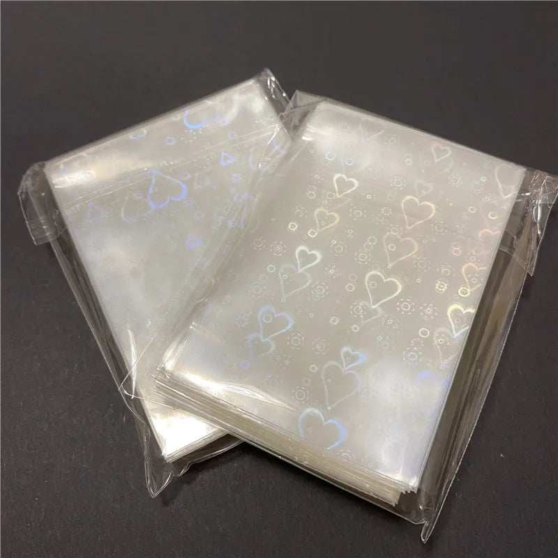 50pcs Heart-Shaped Foil Card Sleeves — 11 Styles, Top-Loading Protector for Pokémon, YGO, Board Games, Photos & K-Pop Cards