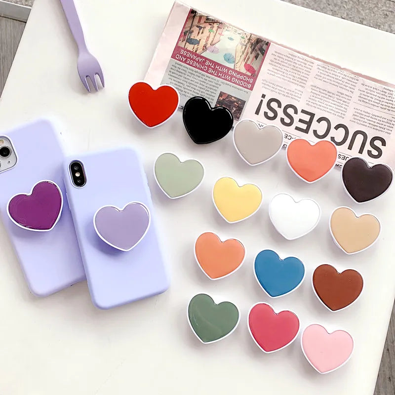 Universal Heart-Shaped Phone Socket Holder: Finger Grip Bracket Support for iPhone 15, 14, 13, Samsung - Pocket Socket Stand