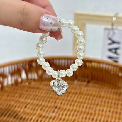17cm Labubu Macaron Sitting Party Ornament — DIY Cute Plush Pendant with Pearl Necklace & Alloy Chain Accessory