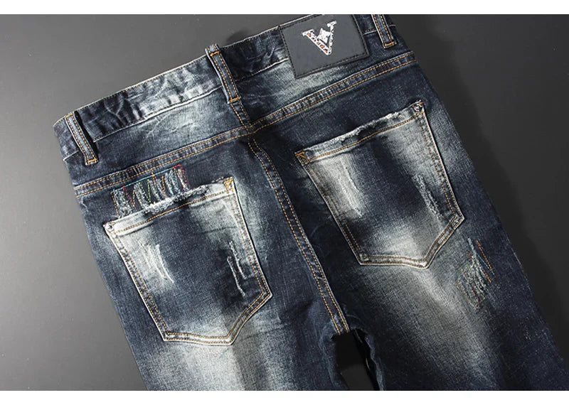 Streetwear Men’s Slim Fit Ripped Jeans – Retro Black & Blue Spliced Denim with Designer Embroidery, Hip Hop Fashion