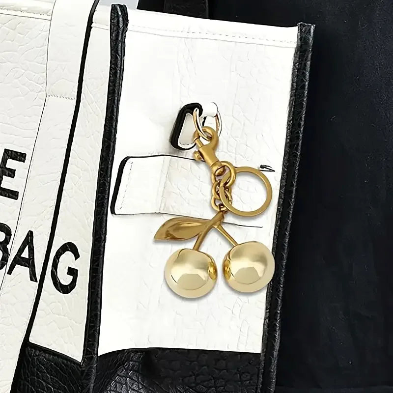 Golden Cherry Keychain Charm — Shiny Resin & Metal Bag Accessory, Elegant Gift for Women