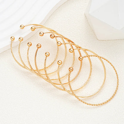 7-Piece Punk Gold Heart Print Bracelet Set for Women – Streetwear Goth Open Metal Bangles Fashion Jewelry Gift 2024