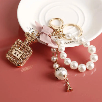 Fashion Pearl Perfume Bottle Keychain — Cute Bow Car & Bag Charm for Women, Creative Key Ring Accessory