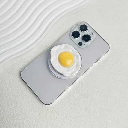 Creative Egg Phone Holder – Foldable Socket Grip & Expanding Stand for iPhone, Samsung, Mac, Magsafe