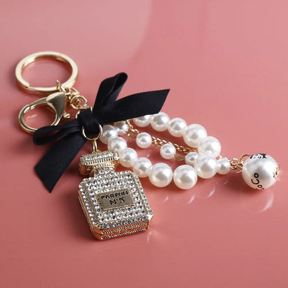 Fashion Pearl Perfume Bottle Keychain — Cute Bow Car & Bag Charm for Women, Creative Key Ring Accessory