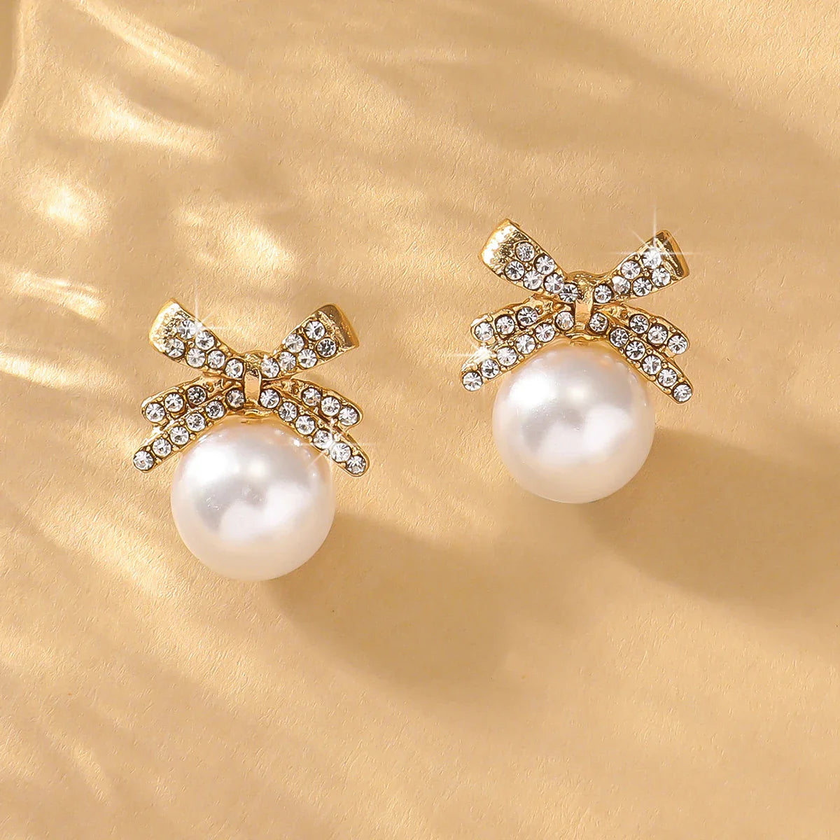 Women’s Silver Bow Earrings with Diamond Pearl – Fashionable High-End Studs