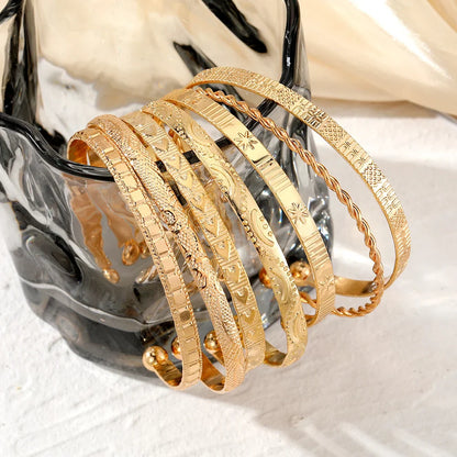 7-Piece Punk Gold Heart Print Bracelet Set for Women – Streetwear Goth Open Metal Bangles Fashion Jewelry Gift 2024