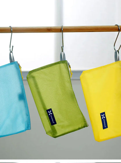 XENOSMILUS Travel Organizer Bag — Waterproof Clothes, Passport & Toiletry Holder with Large Capacity for Cards and IDs