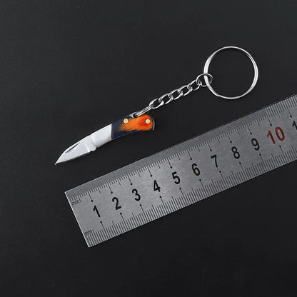 5cm Mini Folding Knife Keychain – Acrylic & Brass Portable Blade Pendant for Camping, Outdoor, and Everyday Carry
