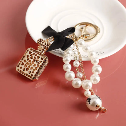 Fashion Pearl Perfume Bottle Keychain — Cute Bow Car & Bag Charm for Women, Creative Key Ring Accessory