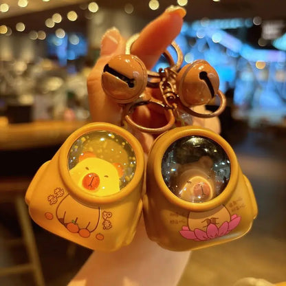 IFYOUOO Luminous Capybara Keychain — Cute Cartoon Space Capsule Keyring for Bags & Gifts