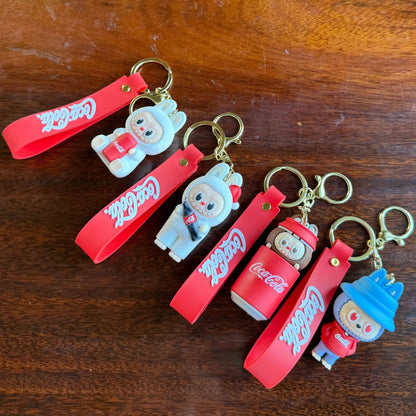 12pcs Labubu Monster Coca Cola Mini Doll Keychains — 4 Styles Action Figures for Kids