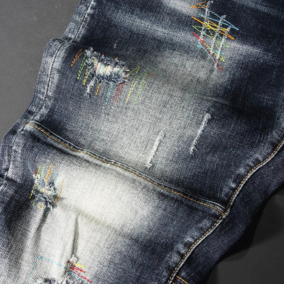 Streetwear Men’s Slim Fit Ripped Jeans – Retro Black & Blue Spliced Denim with Designer Embroidery, Hip Hop Fashion