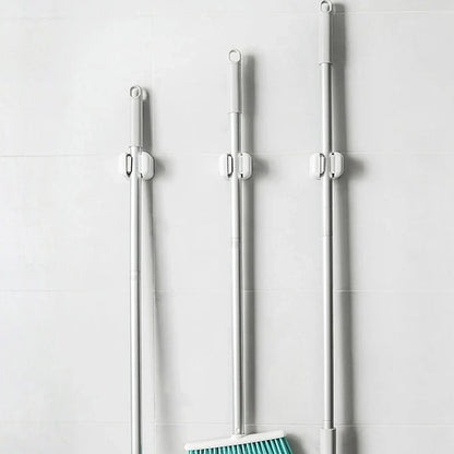 1/4PCS Wall-Mounted Mop Clip Holder — No-Punch Broom & Brush Hanger Rack for Kitchen & Bathroom Organization