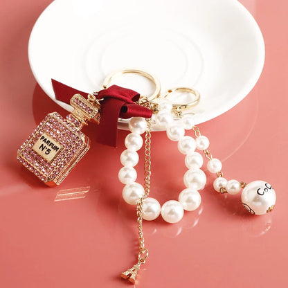 Fashion Pearl Perfume Bottle Keychain — Cute Bow Car & Bag Charm for Women, Creative Key Ring Accessory