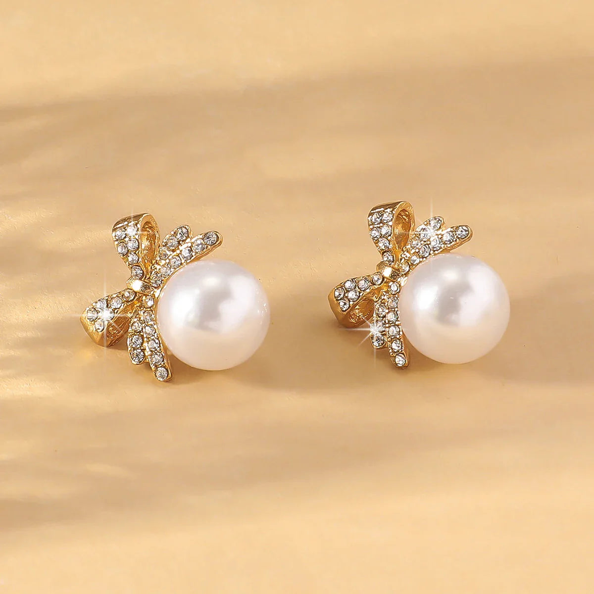 Women’s Silver Bow Earrings with Diamond Pearl – Fashionable High-End Studs