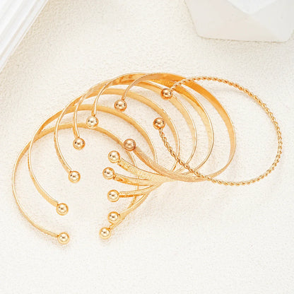 7-Piece Punk Gold Heart Print Bracelet Set for Women – Streetwear Goth Open Metal Bangles Fashion Jewelry Gift 2024