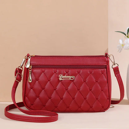 Women’s Embroidered Leather Messenger Bag - Stylish Handbag with Hair Ball Detail